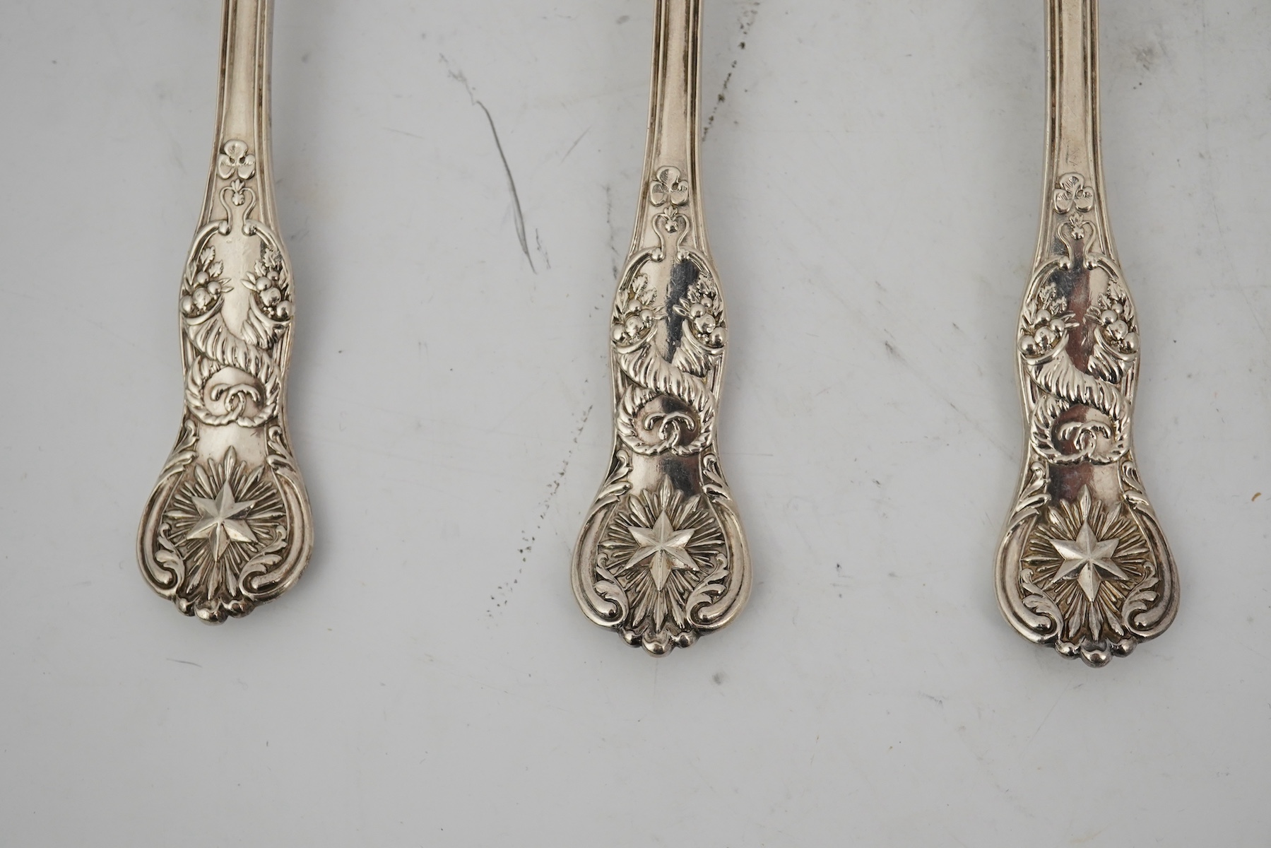 A part canteen of early Victorian silver flatware, by Robert Wallis, double struck with an unusual pattern with entwined cornucopia and a raised star terminal